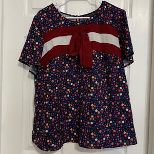 Eloquii floral bow accent short sleeve top